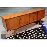 G-Plan Furniture - A teak sideboard, model number 4058, fitted with an arrangement of four central