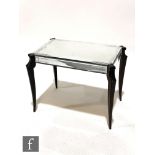 Unknown - An Art Deco mirrored side table, the rectangular engraved top, raised on cabriole legs,