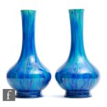 Unknown - A pair of early 20th Century Arts and Crafts vases of footed globe and shaft form