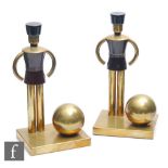 Walter Von Nessen - Chase Sentinel - A pair of Art Deco brass bookends, modelled as stylised toy