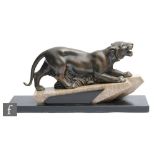 Unknown - A French Art Deco bronzed spelter figure modelled as a panther in hunting pose, raised