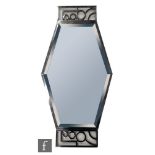 Unknown - An Art Deco wall mirror, the hexagonal bevelled mirror plate, set within a concentric