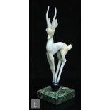 Istvan Komaromy - A lamp work figure of a gazelle all in a marble opal and cinnamon, standing on a