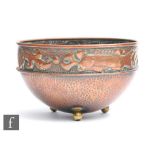 Herbert Dyer - An Arts and Crafts copper bowl decorated with a band of fish and shells with