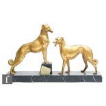 After Louis Albert Carvin - A French Art Deco gilded spelter study of two stylised Borzois, circa