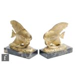 Unknown - A pair of French Art Deco gilded spelter bookends, circa 1930, modelled as stylised