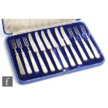 Walker & Hall - A cased set of six Art Deco hallmarked silver handled fruit knives and forks