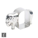 Crisford & Norris - A hallmarked napkin ring modelled as a standing elephant with central arched