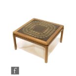 Nathan Furniture ? A teak coffee table of square form, the tiled insert top with abstract design,