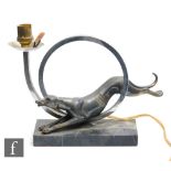 Unknown - An Art Deco table lamp, circa 1930s, decorated with a spelter greyhound jumping through