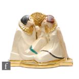 In the manner of Pierre Le Faguays - A French Art Deco style model of a seated Pierrot and