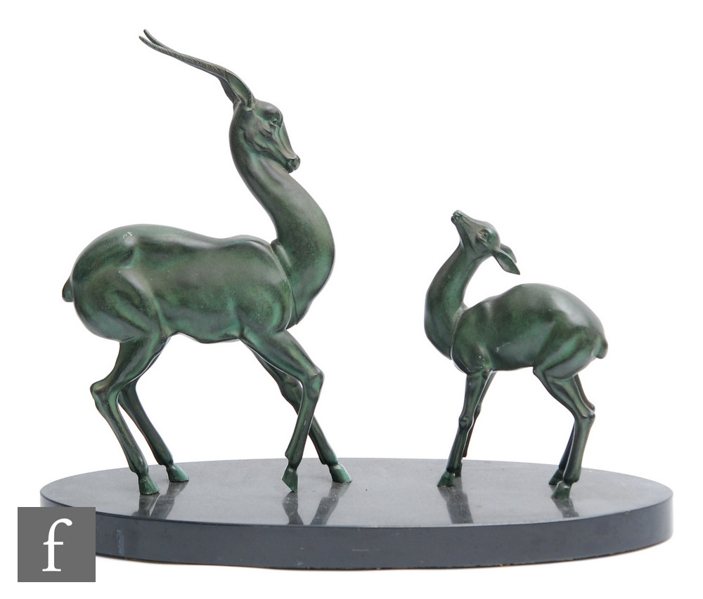 Unknown - An Art Deco green patinated spelter study, circa 1935, of a standing stylised gazelle with