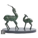 Unknown - An Art Deco green patinated spelter study, circa 1935, of a standing stylised gazelle with