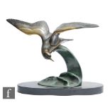 Irenee Rochard - An Art Deco spelter study, circa 1930s, of a seagull in flight over a patinated