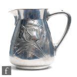 An Art Nouveau polished pewter cream jug, Eduard Hueck for Silberzinn, dated 1910, of tapered