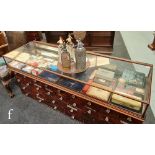 An Edwardian mahogany glazed flat top cabinet, fitted with two reverse mirror doors, height 20cm x