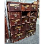 A pair of 19th Century mahogany chemist's drawers each containing thirteen drawers labelled