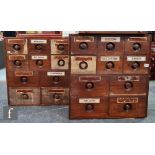 Two early 20th Century small banks of ten chemists drawers, recessed turned handles named SUCC,