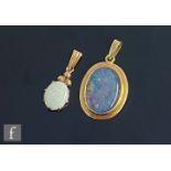 An 18ct mounted opal doublet pendant, weight 3g, length 3cm, with a similar 9ct opal pendant, weight