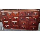 A 19th Century bank of twenty named chemist drawers, reverse gilt painted labels CRET:PREP, CERA.