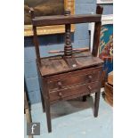 A 19th Century oak book press, the large screw winder over two drawers, turned wood handles on