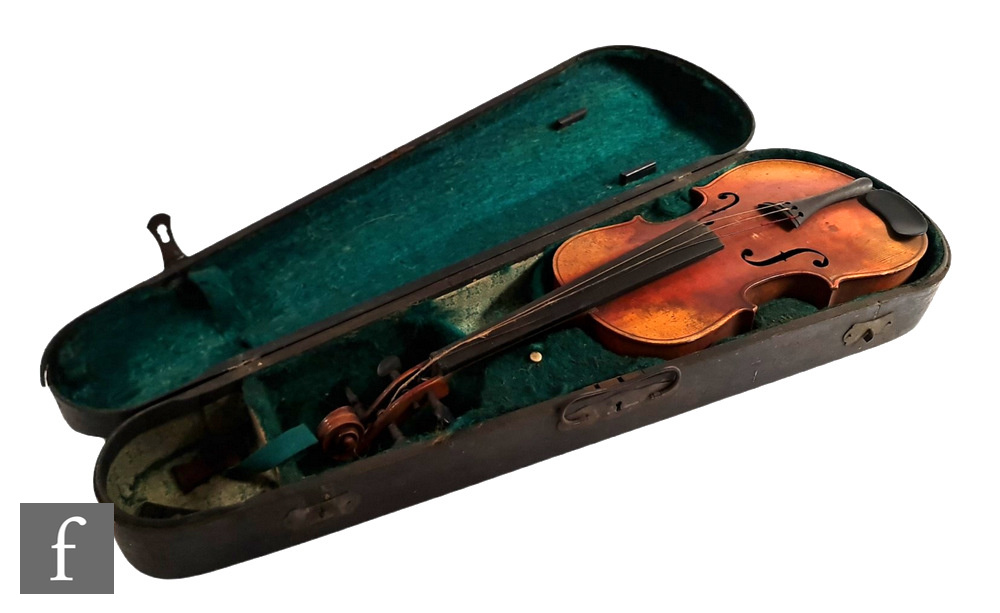 A violin labelled inside The Harrow, length 33.5cm, cased, A/F.