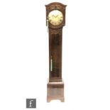 An early 20th Century cross-banded mahogany Grandmother clock in the Georgian style, with an eight-