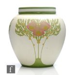 A vase and cover in the Art Nouveau style decorated with stylised flowers and foliage to the bulbous