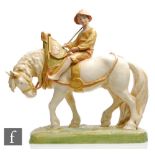 An early 20th Century Royal Dux model of a young boy on a shire horse, all in shot enamels with matt