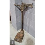 An early 20th Century set of cast iron weighing platform scales by Allen & Hanbury London, height