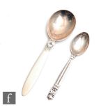 A Danish silver acorn pattern tea spoon 1910-25, and a small cactus pattern example 1933-44, both