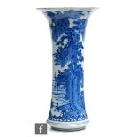 A 19th Century Chinese blue and white sleeve vase, decorated in the Kangxi style with rockwork and