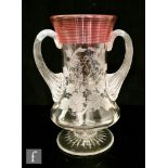 A late 19th Century Stourbridge clear crystal glass loving cup, the waisted pedestal body with