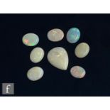 Eight cut and polished loose unused opal stones, seven oval cabochon cut, lengths approximately