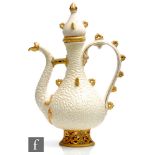 An early 20th Century Zsolnay Pecs Persian ewer, the white textured body with gilt detailing and