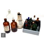 A collection of Victorian and later coloured poison bottles including a four ounce coffin shaped