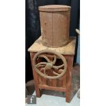 An early 20th Century pharmaceutical powder making machine with spoked wheel handle operation,