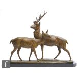 A 20th Century French bronzed spelter study after Irenee Rochard, depicting a stylised standing stag