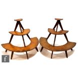 A pair of post 1950s three tiered plywood chemist stands on splayed legs, height 43cm (2)