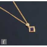 An 18ct hallmarked amethyst and diamond set pendant, square cut collar set amethyst below a single