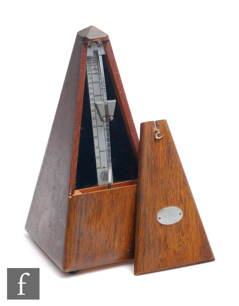 A Maelzel metronome in mahogany case, height 23cm.