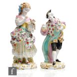 Two 19th Century Dresden type figures, the first modelled as a lady with patterned dress with a