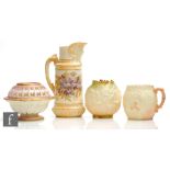 A Royal Worcester blush ivory shape 1366 jug decorated with sprays of violets, the spout formed as a