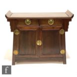 A contemporary Chinese hardwood altar table with twin drawers above two cupboard doors each detailed