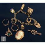 A small parcel lot of 9ct jewellery to include a charm bracelet, two rings, a cameo and bar brooch