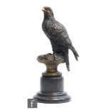A later 20th Century bronze study, modelled as a stylised falcon perched on a decorative plinth,