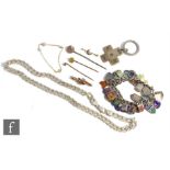 A small parcel lot of assorted jewellery to include two 9ct bar brooches, three 9ct stick pins,