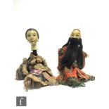 Two Japanese puppets or dolls, circa 1900-1920, the oversized carved wooden and painted heads with