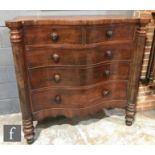 A 19th Century mahogany serpentine fronted chest of two short over three long drawers, with turned