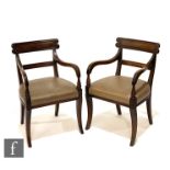 A set of six William IV mahogany dining chairs, the scroll yoke top rails above drop-in seat pads